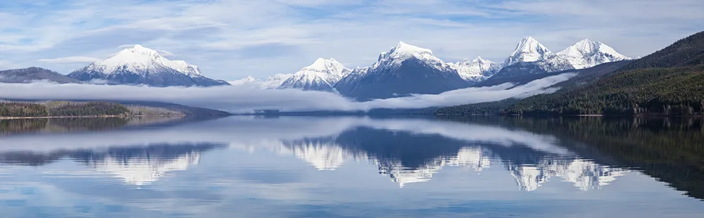 Lake McDonald with mountains and low fog, Glacier National Park