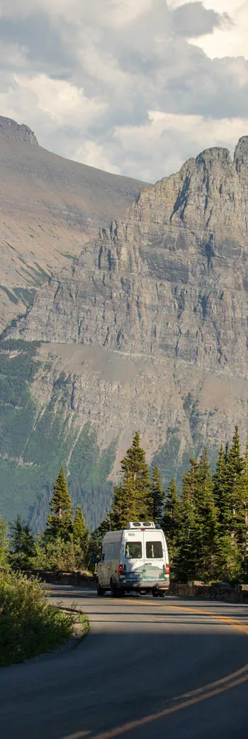 Shuttle bus and mountains at Logan Pass on the Going-to-the-Sun Road, Glacier National Park