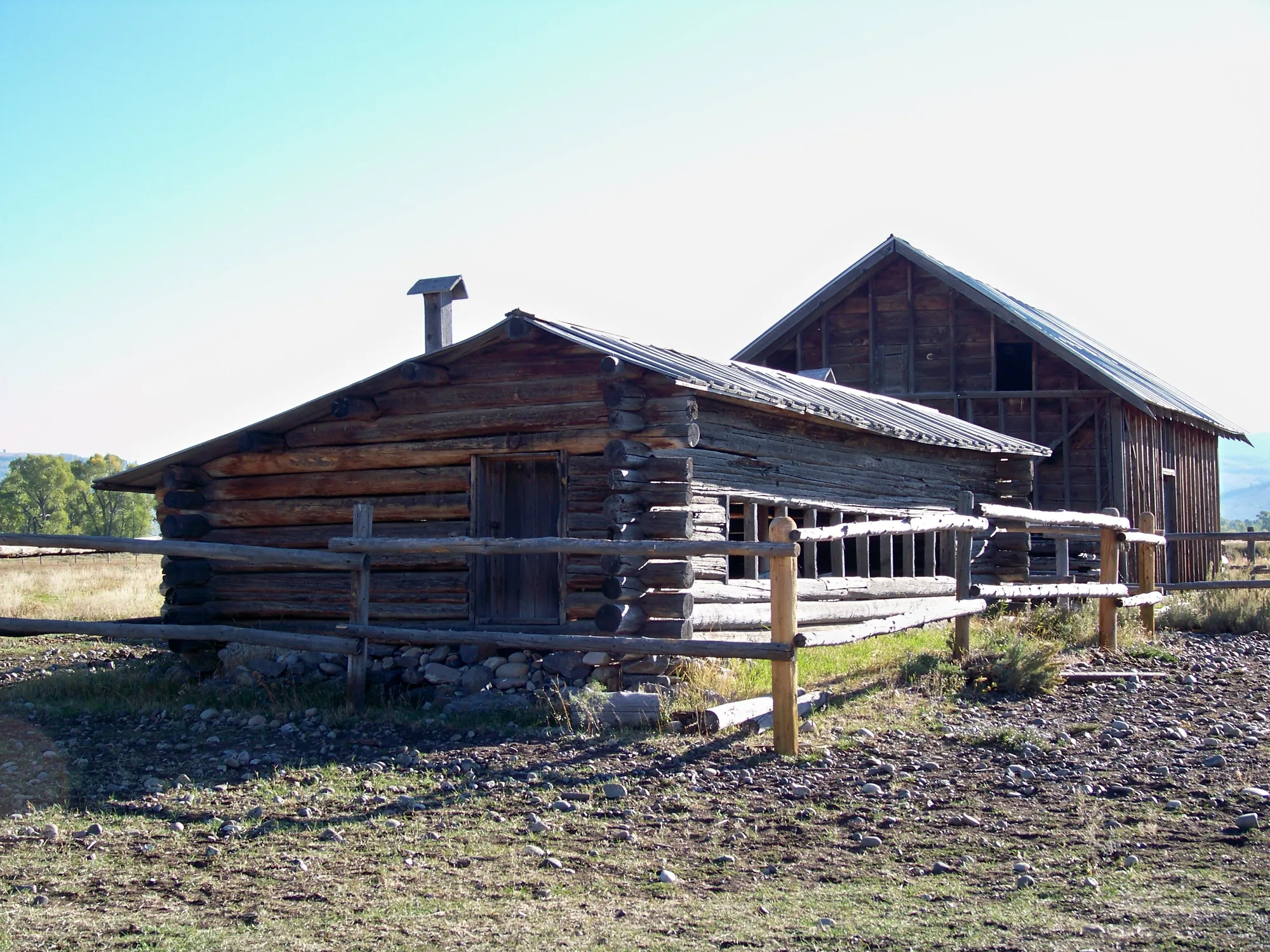 Historic ranch buildings on the valley floor below the Teton Range, Grand Teton National Park